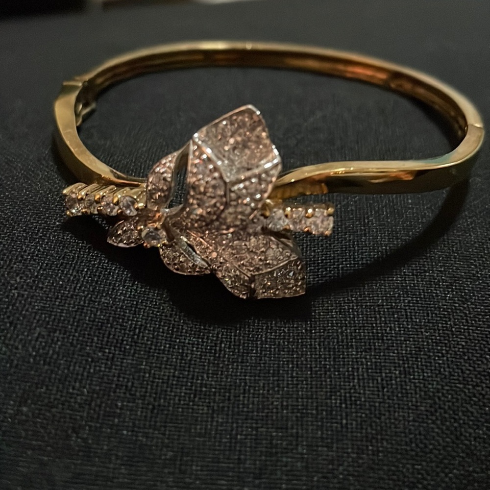 Gold tone bracelet with rhinestone accent